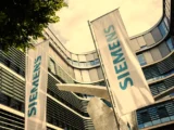 Siemens-Zentrale mit Börsenkurs zur Siemens-Aktie und Symbolen für Automatisierung und Energiewende.